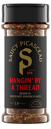 Saucy Picasceau Reserve Hangin' By A Thread dried hot pepper flakes