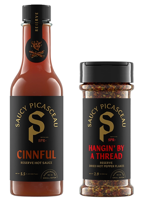 Saucy Picasceau Reserve Cinnful hot sauce and Hangin' By a Thread dried hot pepper flakes
